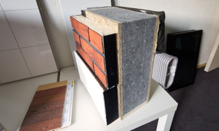 Illustration for article titled This Handsome Brick Facade Is Insulation That Snaps on Like Lego